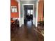 Hallway with hardwood floors showing access to the Dining Room and Living Room at 227 Shellbark Dr, Mcdonough, GA 30252
