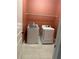 Laundry room with washer and dryer hookups on white tile at 227 Shellbark Dr, Mcdonough, GA 30252