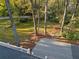 A beautiful backyard featuring a well-maintained lawn and mature trees surrounded by a white picket fence at 615 Collier Nw Rd, Atlanta, GA 30318