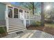 A backyard view of a home with a covered porch and elevated deck with stairs at 615 Collier Nw Rd, Atlanta, GA 30318