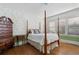 Bedroom features original hardwood floors, beautiful wallpaper, and many windows allowing natural light at 615 Collier Nw Rd, Atlanta, GA 30318