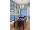 Breakfast nook featuring blue and white floral wallpaper, hardwood floors, and a vintage chandelier at 615 Collier Nw Rd, Atlanta, GA 30318