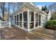 Exterior view of the charming home with a screened porch and wooden deck at 615 Collier Nw Rd, Atlanta, GA 30318