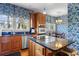 Spacious kitchen with stainless steel appliances, center island, and adjacent breakfast area at 615 Collier Nw Rd, Atlanta, GA 30318