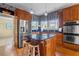 Kitchen boasting stainless steel appliances, a kitchen island, and blue patterned wallpaper at 615 Collier Nw Rd, Atlanta, GA 30318