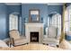 Cozy living room featuring a fireplace, mantle, and classic architectural details at 615 Collier Nw Rd, Atlanta, GA 30318