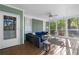 Inviting screened porch with comfortable seating and natural light at 615 Collier Nw Rd, Atlanta, GA 30318