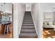 Staircase leading up to other floors featuring neutral colors and adjacent living areas at 615 Collier Nw Rd, Atlanta, GA 30318