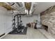 Finished basement featuring a workout area and a brick fireplace at 1195 Braselton Hwy, Lawrenceville, GA 30043