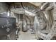 Basement utility area with exposed pipes and a Liberty Safe at 1195 Braselton Hwy, Lawrenceville, GA 30043