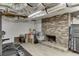 A basement space, featuring a non-functional fireplace and ample storage at 1195 Braselton Hwy, Lawrenceville, GA 30043