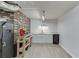 Finished basement area featuring a sink, mini fridge, and stylish white cabinetry at 1195 Braselton Hwy, Lawrenceville, GA 30043