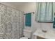 Cozy bathroom with a vanity sink, toilet, and patterned shower curtain at 1195 Braselton Hwy, Lawrenceville, GA 30043