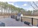 Outdoor deck featuring dark railings and flooring with backyard view at 1195 Braselton Hwy, Lawrenceville, GA 30043
