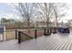 Outdoor deck with dark railings and Trex-like flooring with a view of the backyard at 1195 Braselton Hwy, Lawrenceville, GA 30043
