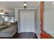Welcoming foyer with wood floors, closet, and view of the living room, creating a warm entry at 1195 Braselton Hwy, Lawrenceville, GA 30043