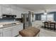 Open concept kitchen and dining area featuring stainless steel appliances, granite counters and eat in table at 1195 Braselton Hwy, Lawrenceville, GA 30043