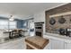 Kitchen with stainless appliances, granite counters, stylish brick accent wall, and eat in table at 1195 Braselton Hwy, Lawrenceville, GA 30043