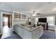 Spacious living room with large sectional couch, built-in shelves, and open access to other living spaces at 1195 Braselton Hwy, Lawrenceville, GA 30043