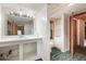 Bathroom with built-in storage, a large mirror, and unique green tiled flooring at 1615 Hilltop Ct, Woodstock, GA 30188