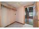 Walk-in closet featuring a rod and shelf, with an open doorway to the bedroom at 1615 Hilltop Ct, Woodstock, GA 30188