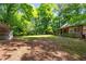 Exterior view of a log cabin style house with a metal awning in the backyard at 1615 Hilltop Ct, Woodstock, GA 30188