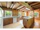 The kitchen features a granite countertop, plenty of counter space, and wood walls at 1615 Hilltop Ct, Woodstock, GA 30188