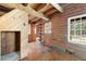 The home features wood floors and a wooden beamed ceiling at 1615 Hilltop Ct, Woodstock, GA 30188