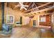 The living room of this home features exposed wood, a ceiling fan, and a heater at 1615 Hilltop Ct, Woodstock, GA 30188
