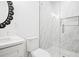 Bright white bathroom features a sleek glass shower at 3078 Turning Creek Trl, Dacula, GA 30019