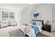 Cozy bedroom featuring an ensuite bathroom, and a view of the private backyard at 3078 Turning Creek Trl, Dacula, GA 30019