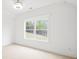 Bedroom with a large window and neutral color palette at 3078 Turning Creek Trl, Dacula, GA 30019