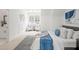 Airy bedroom with a sitting area, en-suite bathroom, and modern decor create a cozy ambiance at 3078 Turning Creek Trl, Dacula, GA 30019