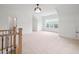 Large bonus room with plush carpeting and a chandelier at 3078 Turning Creek Trl, Dacula, GA 30019