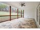 Covered patio with stained wood pillars and decorative stone floor at 3078 Turning Creek Trl, Dacula, GA 30019