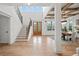 Bright foyer with hardwood floors, staircase, soaring ceilings and natural light at 3078 Turning Creek Trl, Dacula, GA 30019