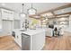 Open concept kitchen view with island, stainless appliances, and modern finishes at 3078 Turning Creek Trl, Dacula, GA 30019