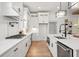 The kitchen features modern stainless steel appliances, white cabinets, and a breakfast bar at 3078 Turning Creek Trl, Dacula, GA 30019