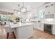 Gourmet kitchen boasts stainless appliances, a wine fridge, and a center island at 3078 Turning Creek Trl, Dacula, GA 30019