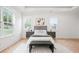 Spacious main bedroom showcases a modern design, sleek furniture, and natural light at 3078 Turning Creek Trl, Dacula, GA 30019