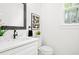 Stylish powder room with quartz counters and modern fixtures at 3078 Turning Creek Trl, Dacula, GA 30019