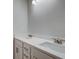 Bathroom featuring double sinks, white cabinets, and elegant hardware for a modern, functional space at 412 Westmarch Cir, Loganville, GA 30052