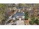 Aerial view of house featuring a large lawn, long driveway and trees at 450 Birkdale Dr, Fayetteville, GA 30215