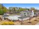 A stunning aerial view showcasing the pool and well-maintained grounds of the estate at 450 Birkdale Dr, Fayetteville, GA 30215