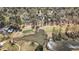 Aerial view of homes surrounding a lake on a golf course at 450 Birkdale Dr, Fayetteville, GA 30215