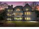 Exterior backyard view of home featuring balconies and outdoor living space at 450 Birkdale Dr, Fayetteville, GA 30215