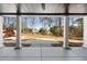Covered porch view of spacious backyard with mature trees at 450 Birkdale Dr, Fayetteville, GA 30215