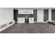 Finished basement featuring a dry bar with drink fridge, seating, and storage at 450 Birkdale Dr, Fayetteville, GA 30215