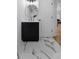 Bathroom featuring white and black tile floors, modern fixtures, and minimalist design, with a view into the living area at 450 Birkdale Dr, Fayetteville, GA 30215