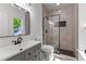 Modern bathroom featuring a sleek vanity with a black faucet and a glass-enclosed shower at 450 Birkdale Dr, Fayetteville, GA 30215